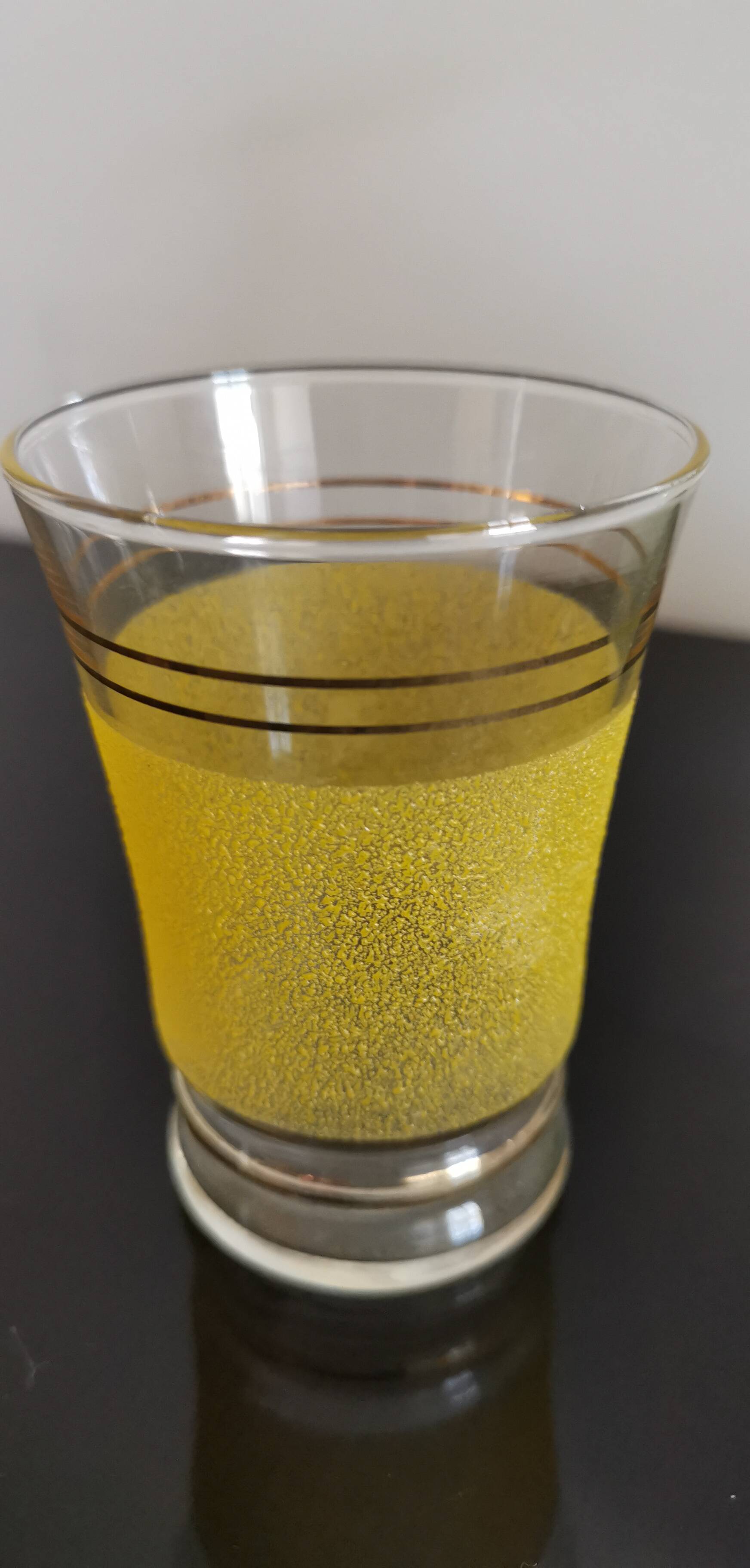 Set of 4 colored granite glasses with its carafe