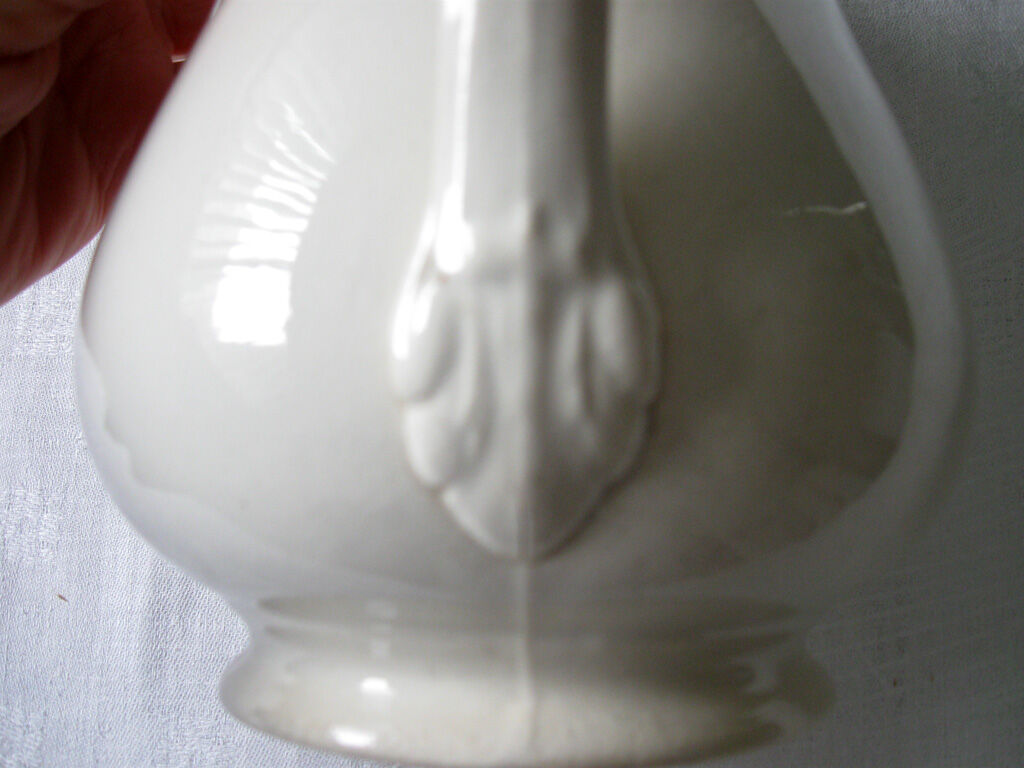 Old toilet bro in white earthenware