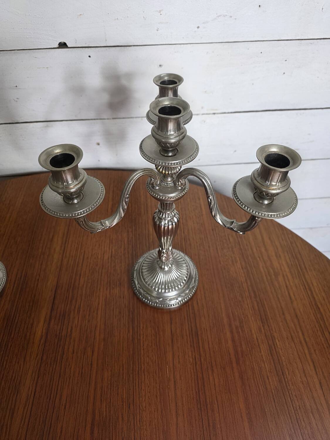 Pair of Louis XVI style candlesticks in silver-plated bronze