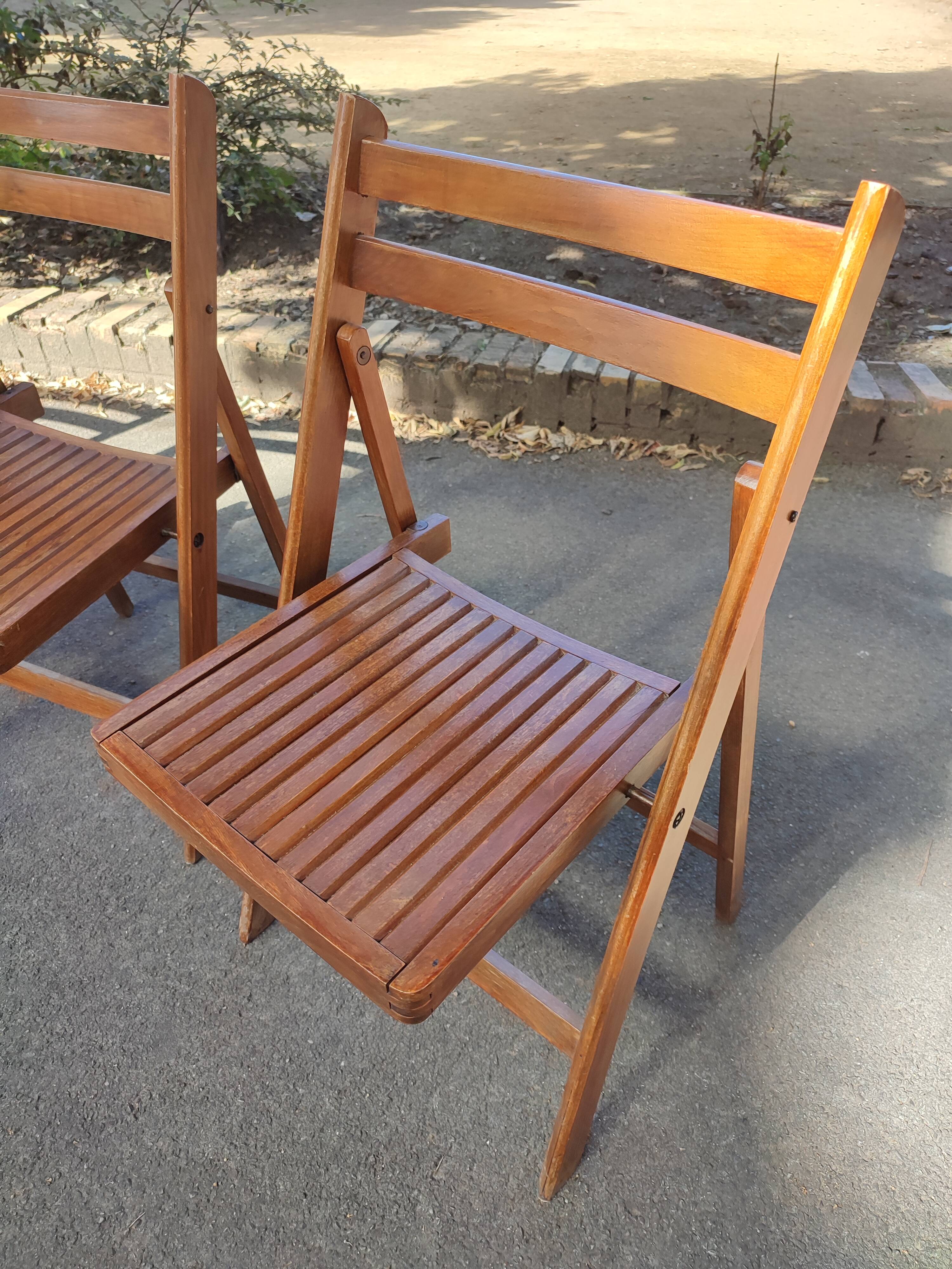 4 folding teak chairs
