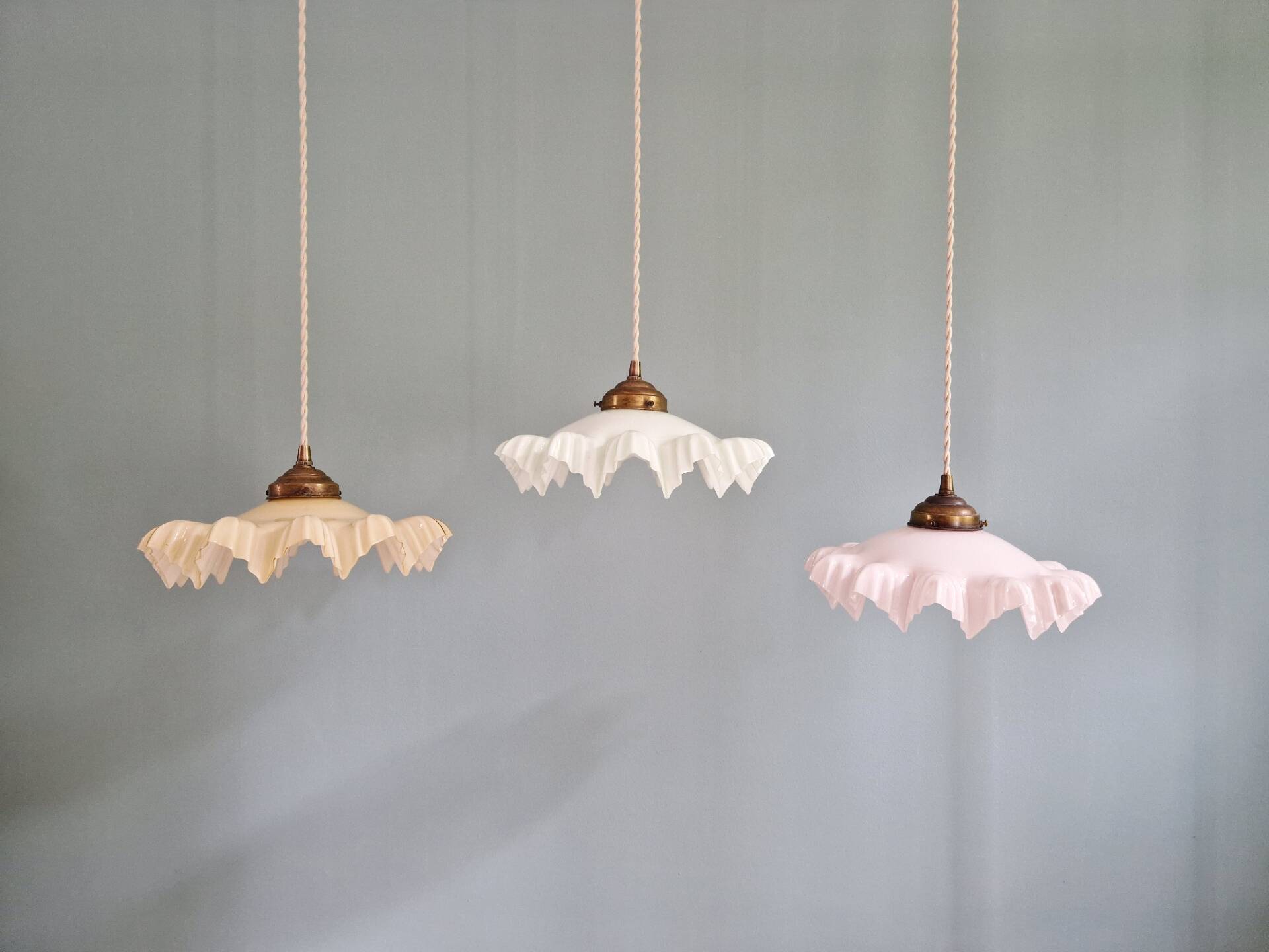 Art Deco trio of suspensions in coloured frilled opaline, 1920-30.