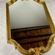 Hexagonal mirror in gilded wood