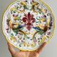Decorative wall plate in hand-painted earthenware