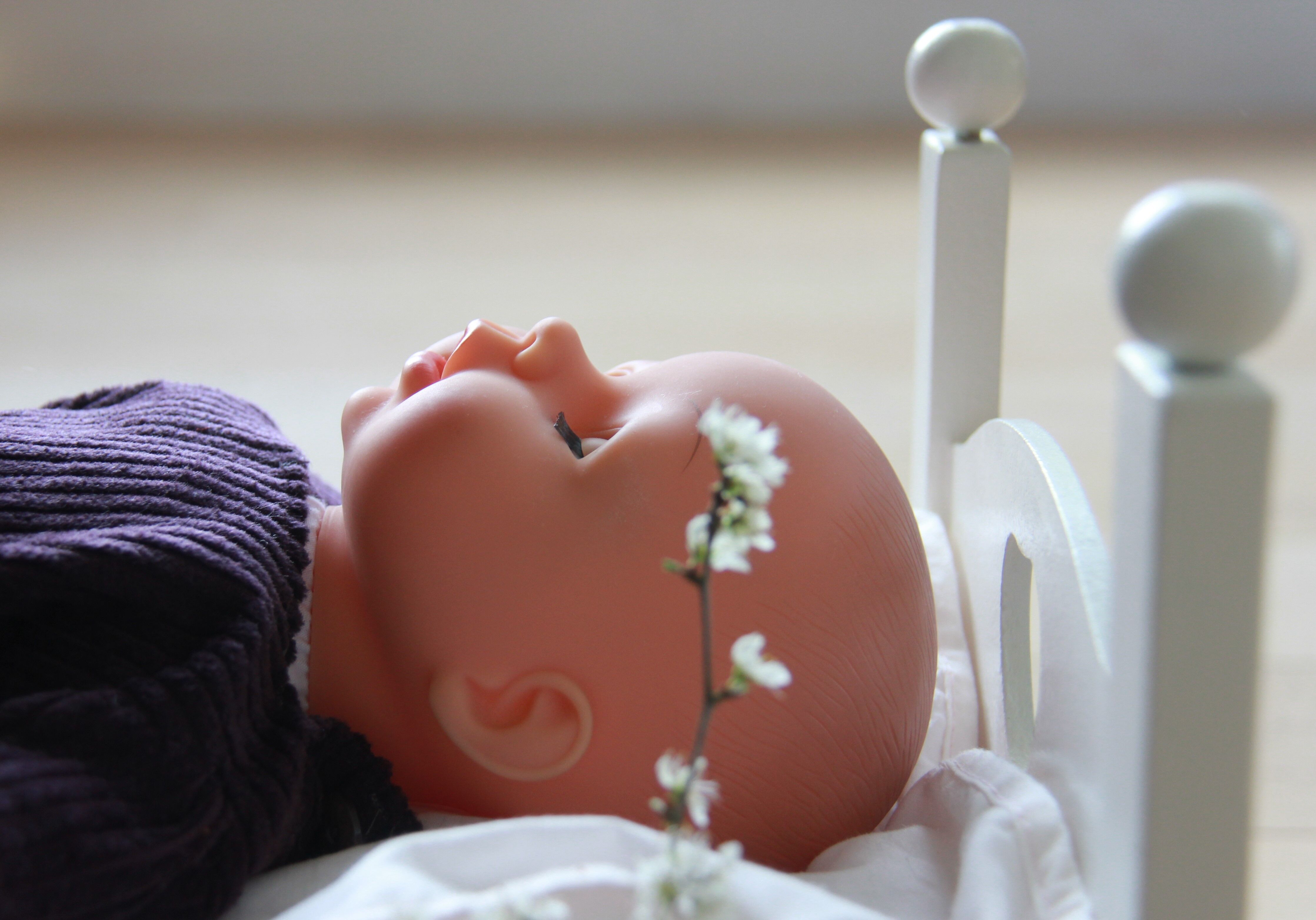 Painted wooden doll bed