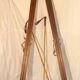 pair of vintage wooden Skis and their bats.