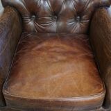 Cognac colored brown grained cowhide chesterfield armchair