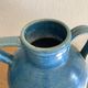 Old oriole in speckled blue glazed stoneware, south-west.