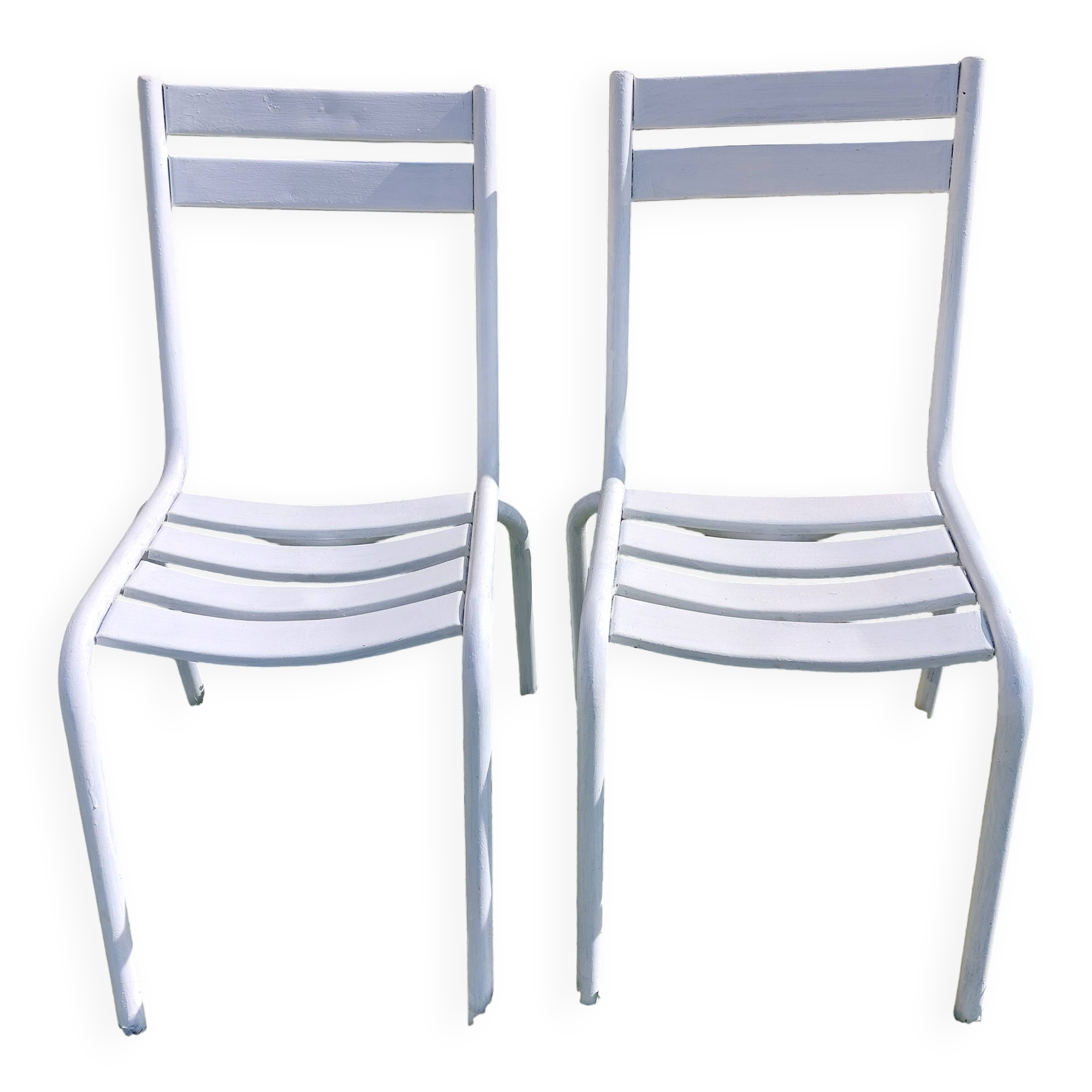 pair of white metal chairs, Tolix style