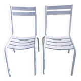 pair of white metal chairs, Tolix style