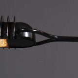 Floor lamp made from black painted metal with balancing arm