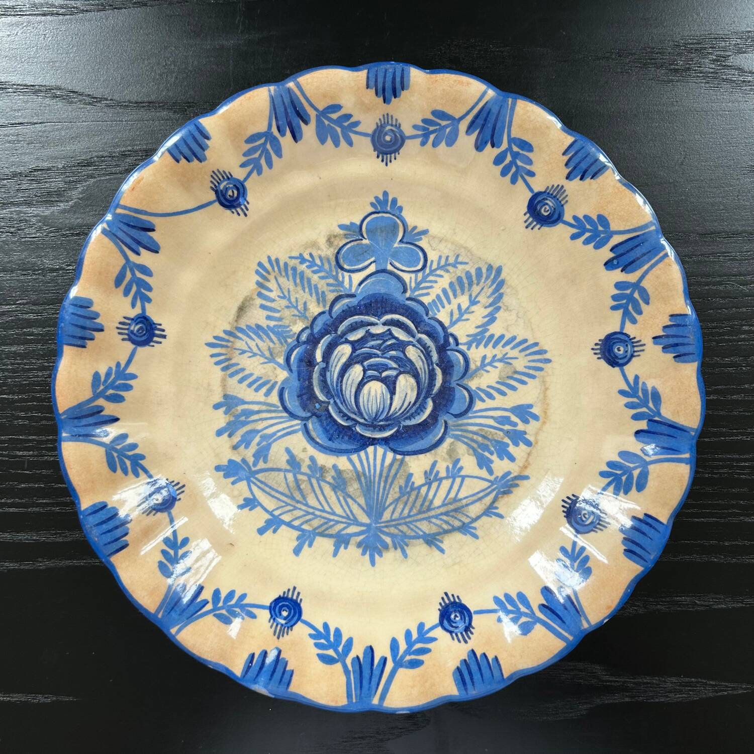 Old dish with blue floral decoration