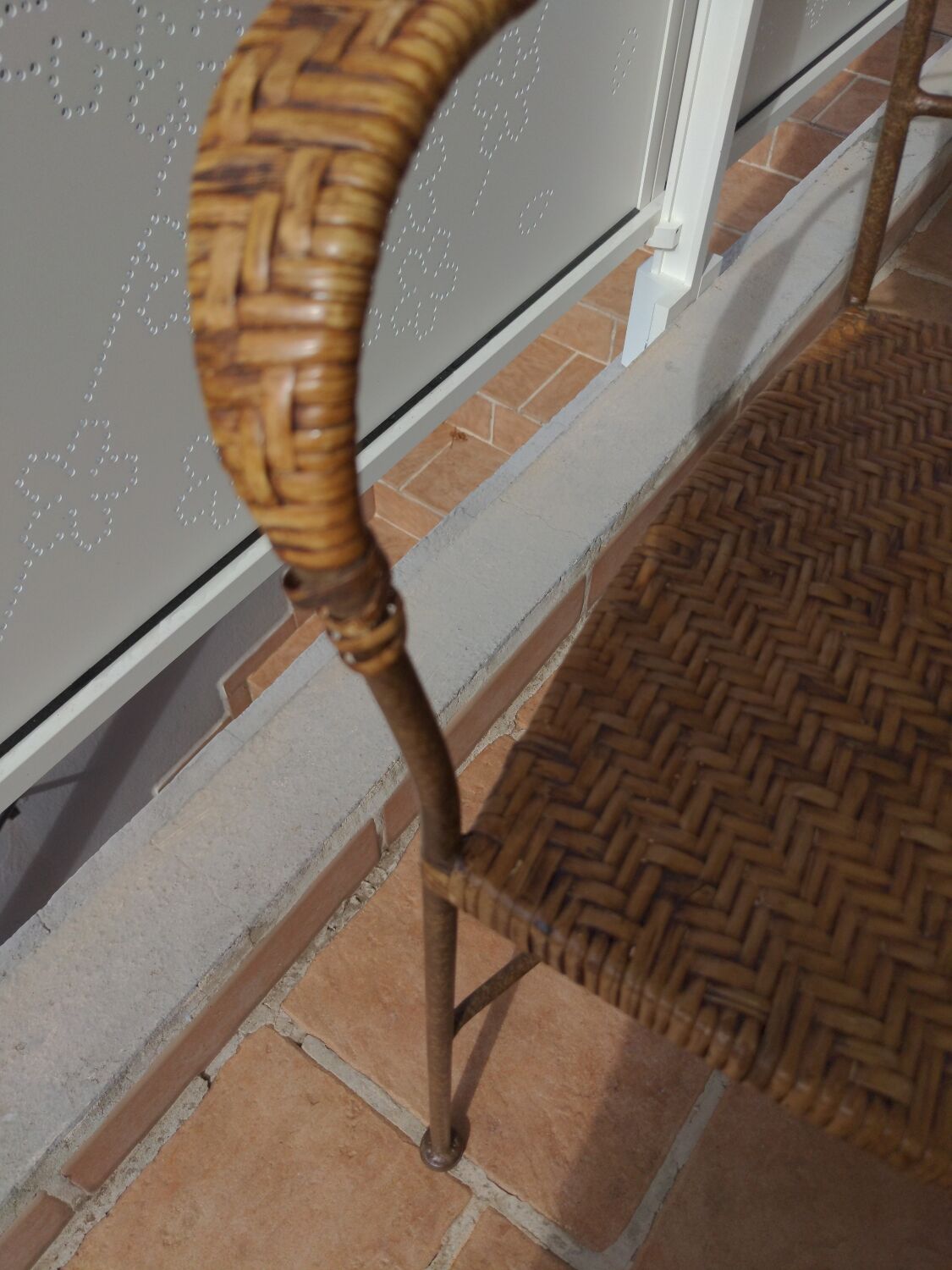 Wicker armchair and wrought iron