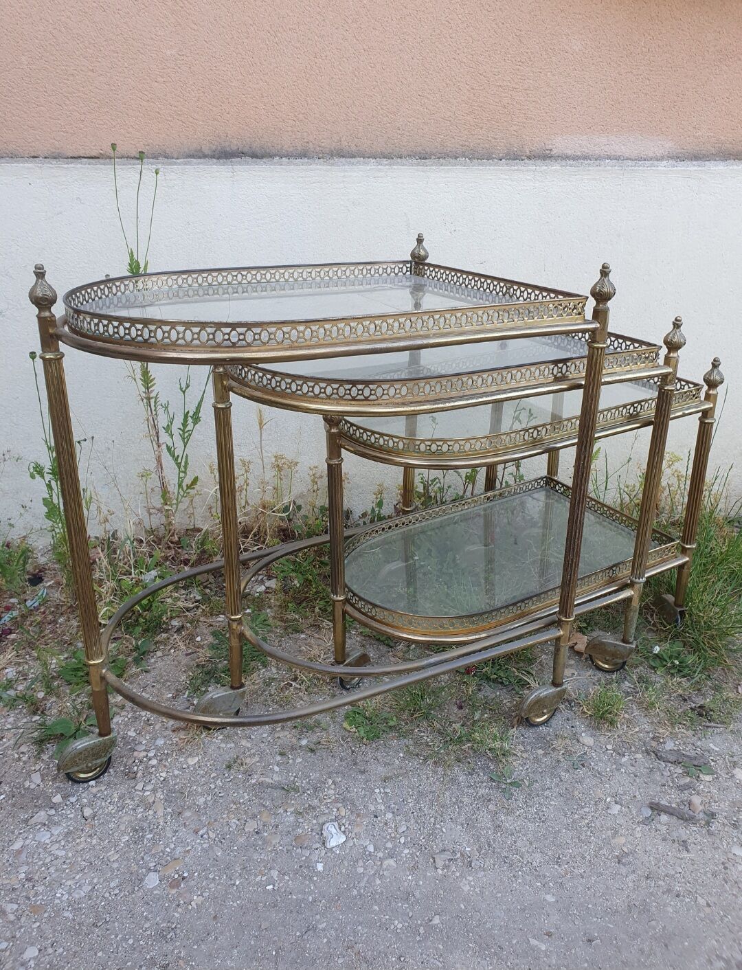Set of nesting brass and glass serving trolleys