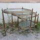 Set of nesting brass and glass serving trolleys