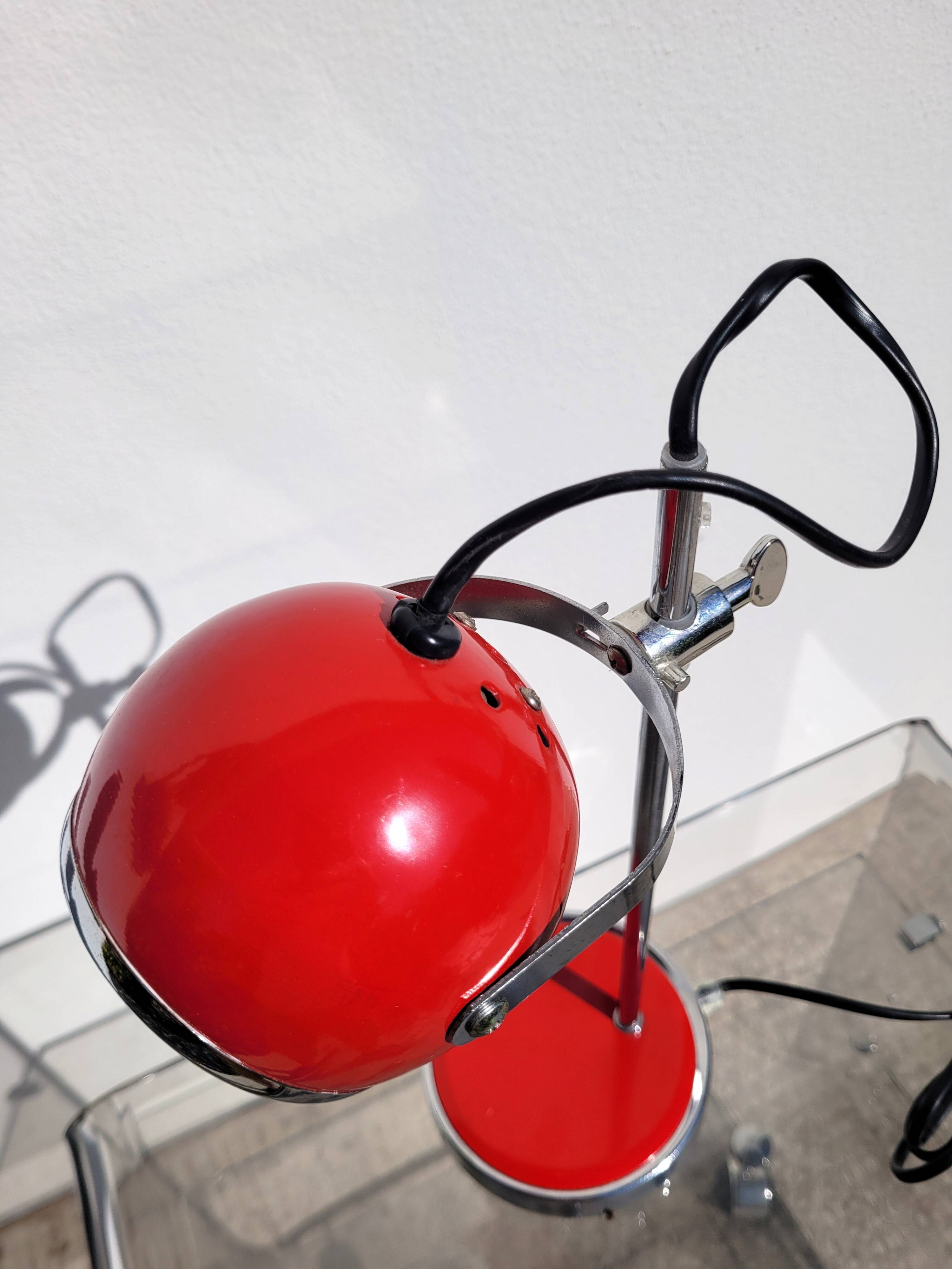 Red and chrome eyeball lamp