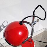 Red and chrome eyeball lamp