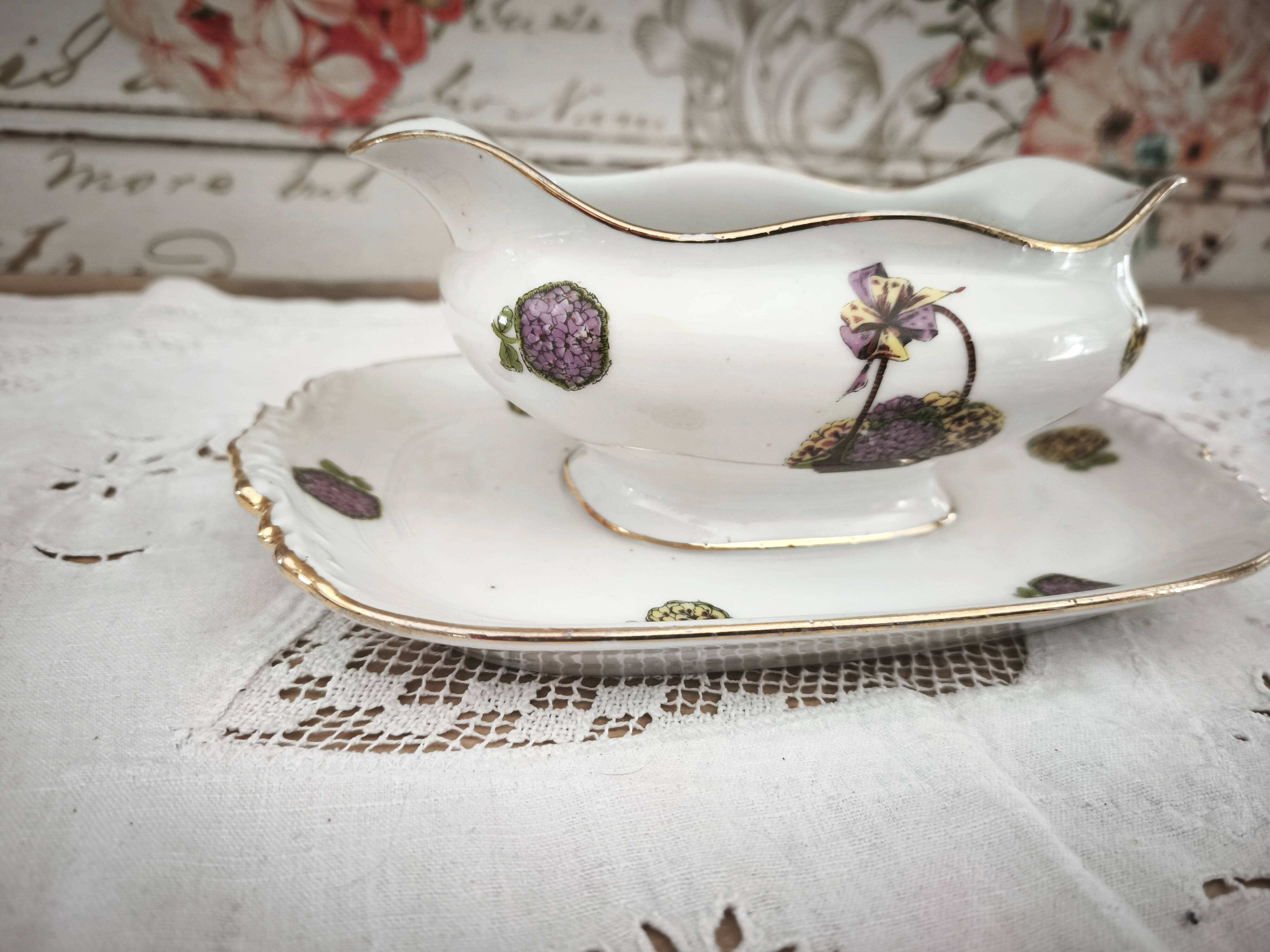 Sauce boat on a Limoges porcelain base with a hydrangea basket design.