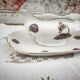 Sauce boat on a Limoges porcelain base with a hydrangea basket design.