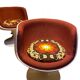 Two cognac-colored swivel chairs made of fiberglass from the 1970s