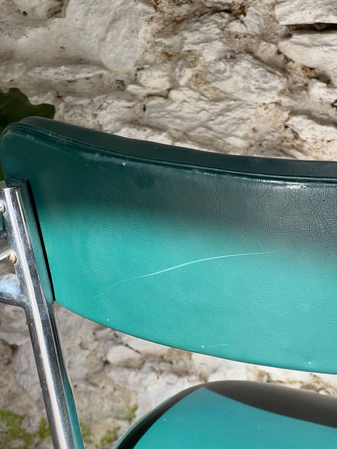Pair of green vinyl and chrome armchairs, mid-century