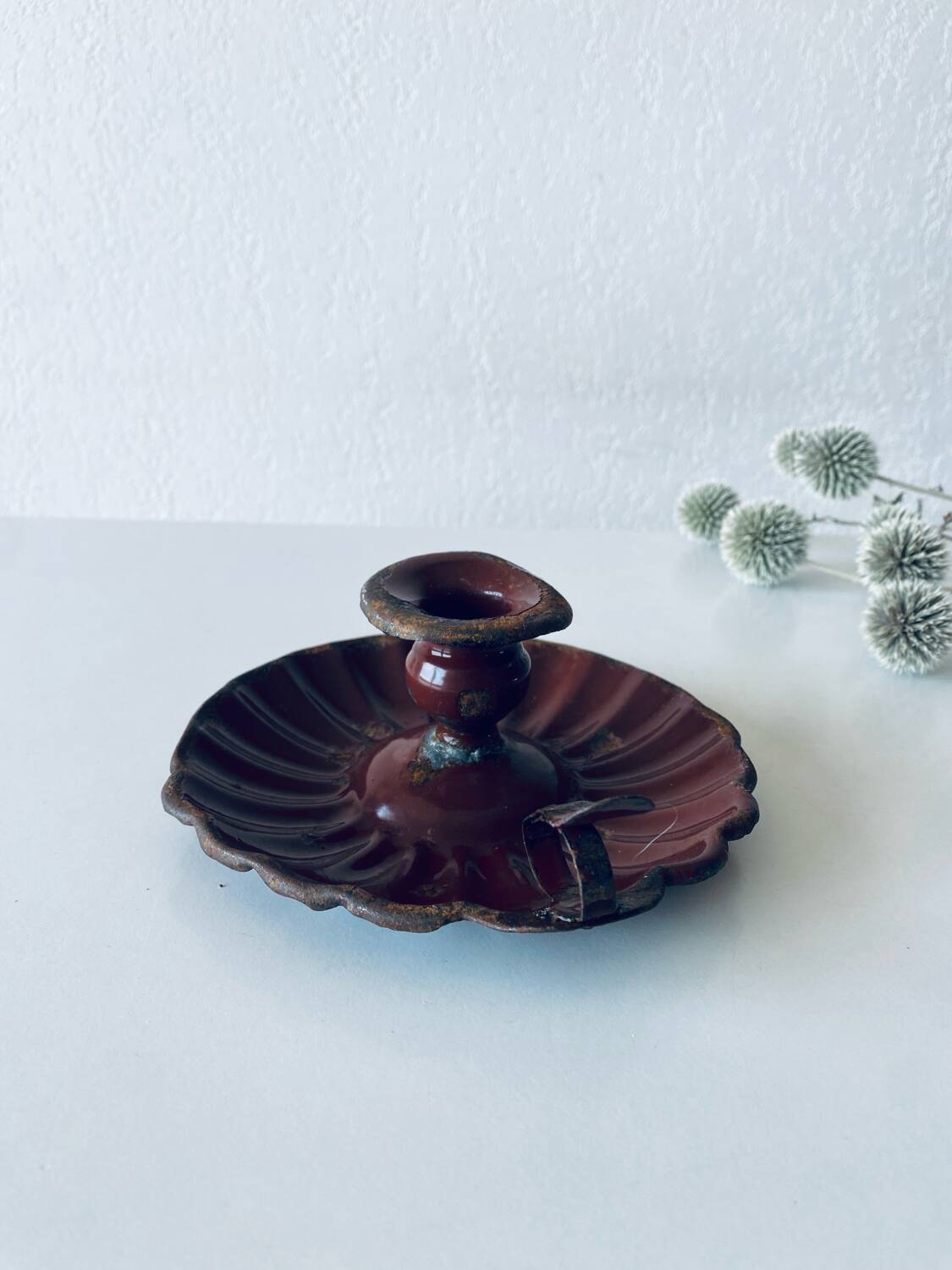 Antique enamelled candle holder