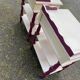 2 vintage bedside tables painted in white and purple with a drawer.