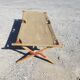 Ancien lit de camp militaire en bois et toile