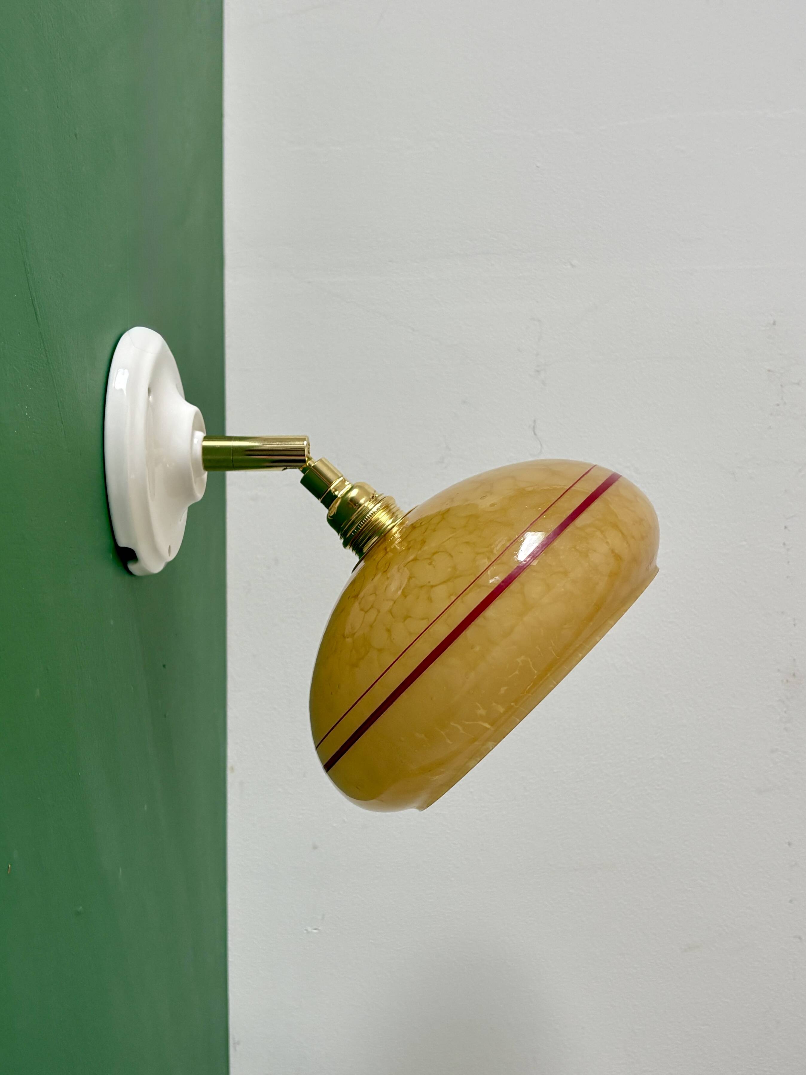 Vintage wall lamp with yellow clichy glass shade and red trim