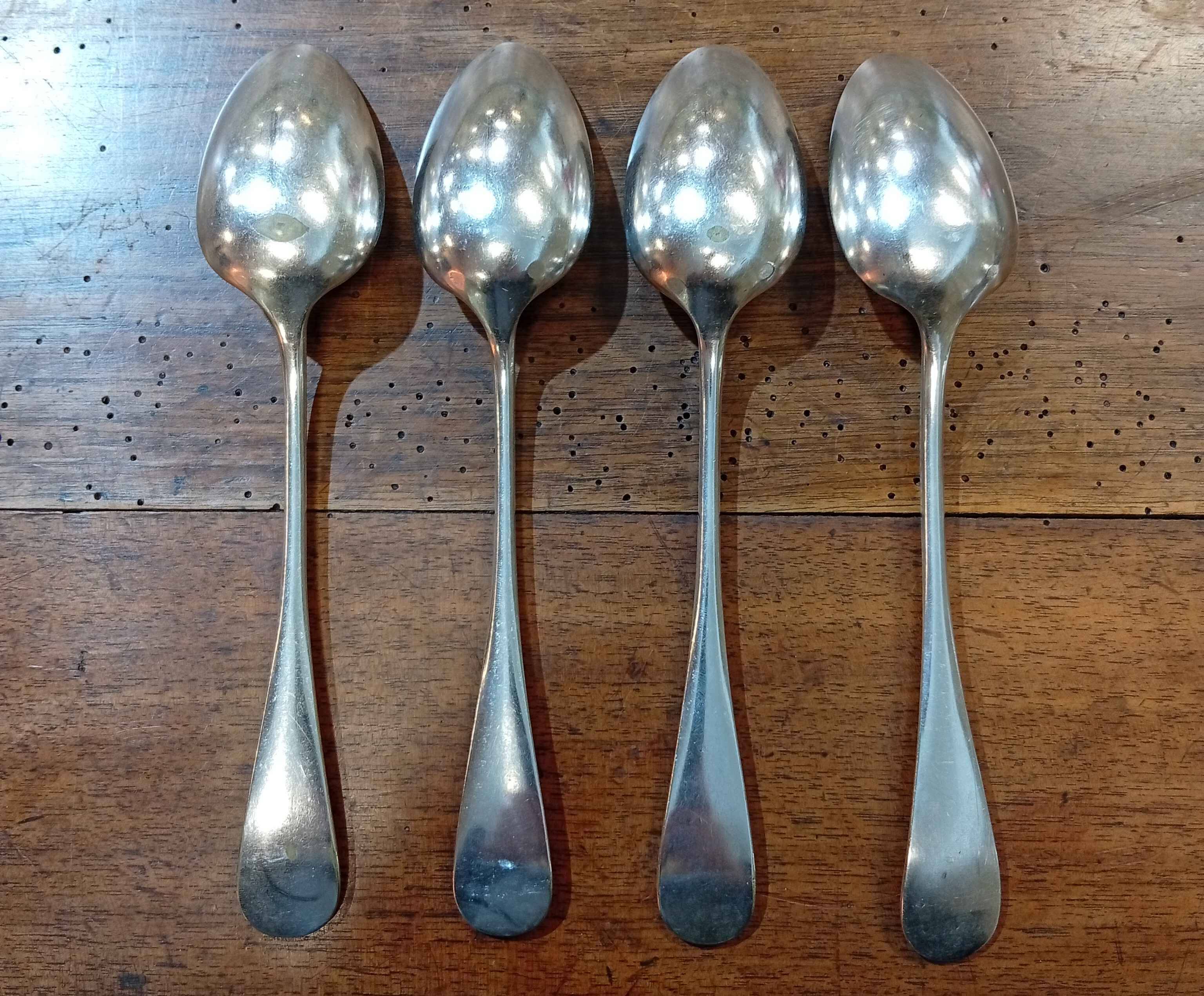 Set of 4 large spoons in the Vieux Paris style in silver-plated metal.