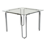 Italian vintage dining table with smooth glass and tubular frame base