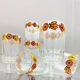 Vintage stemmed glass with floral decoration