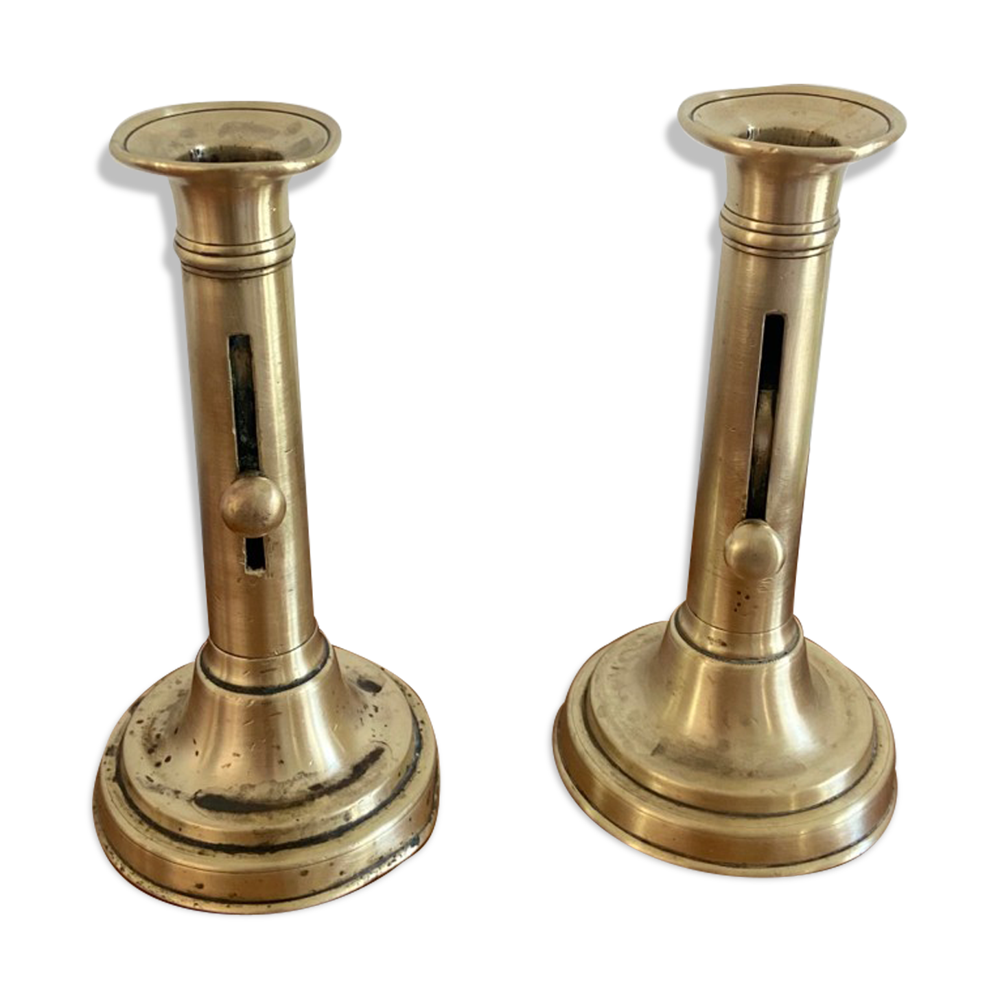 Pair of antique brass push candlesticks