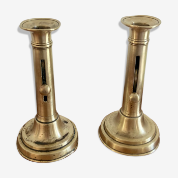 Pair of antique brass push candlesticks