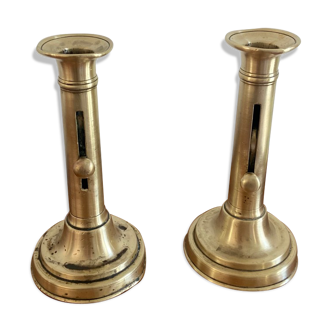 Pair of antique brass push candlesticks