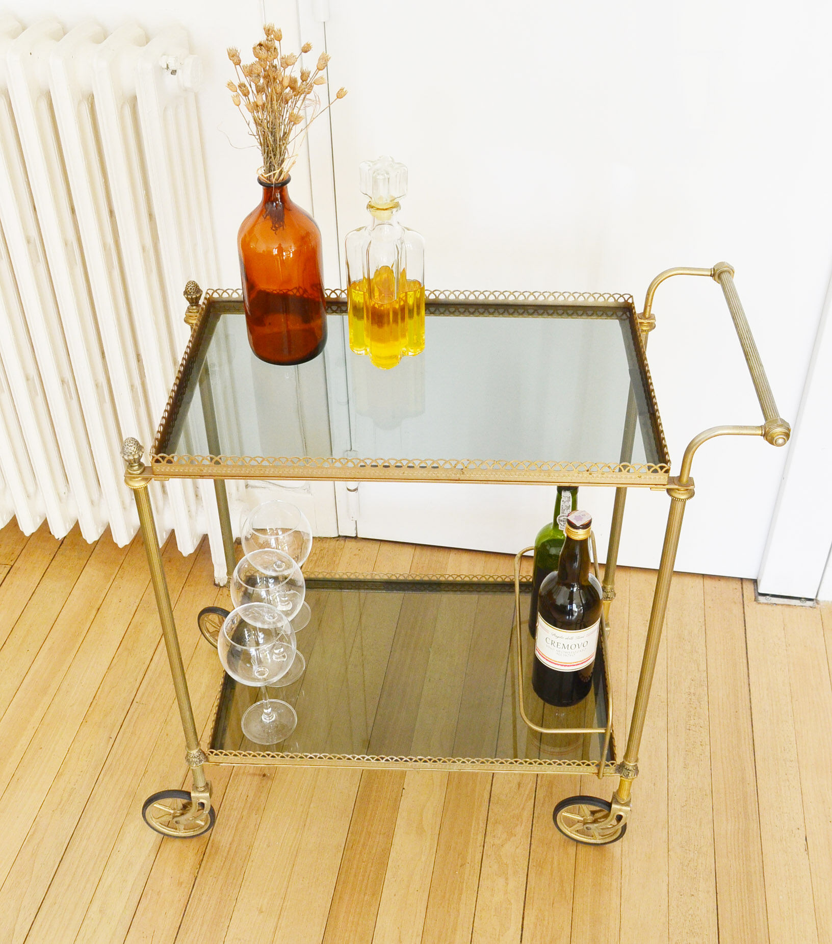 Glass and gold metal wheeled serving table 1960