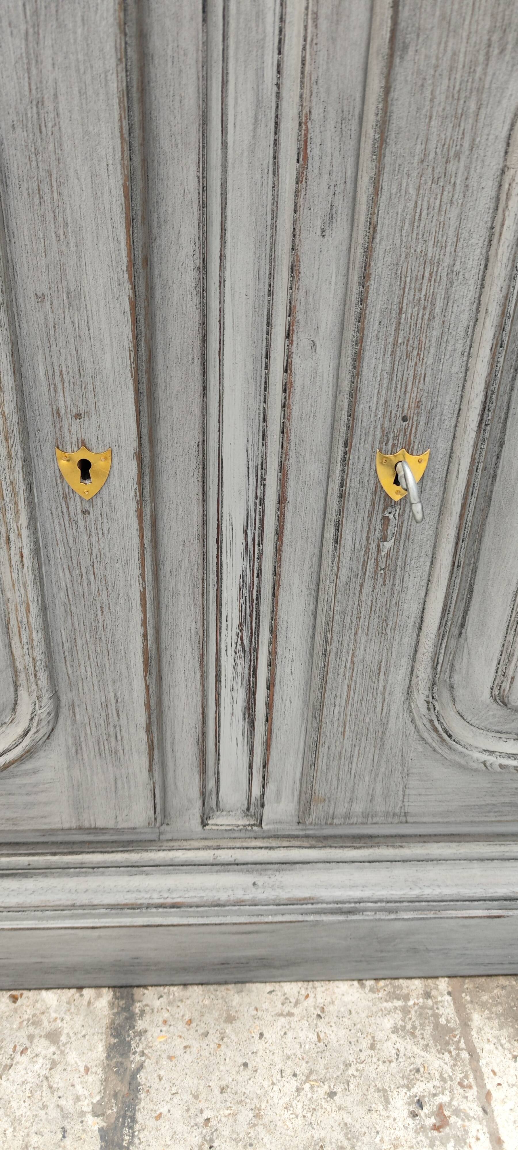 Grey patina furniture with three doors and three drawers