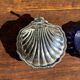 Vintage silver-plated shell butter dish with blue bowl.