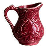 Red ceramic milk jug