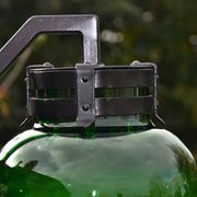 Imposing wall light in thick glass and vintage riveted steel