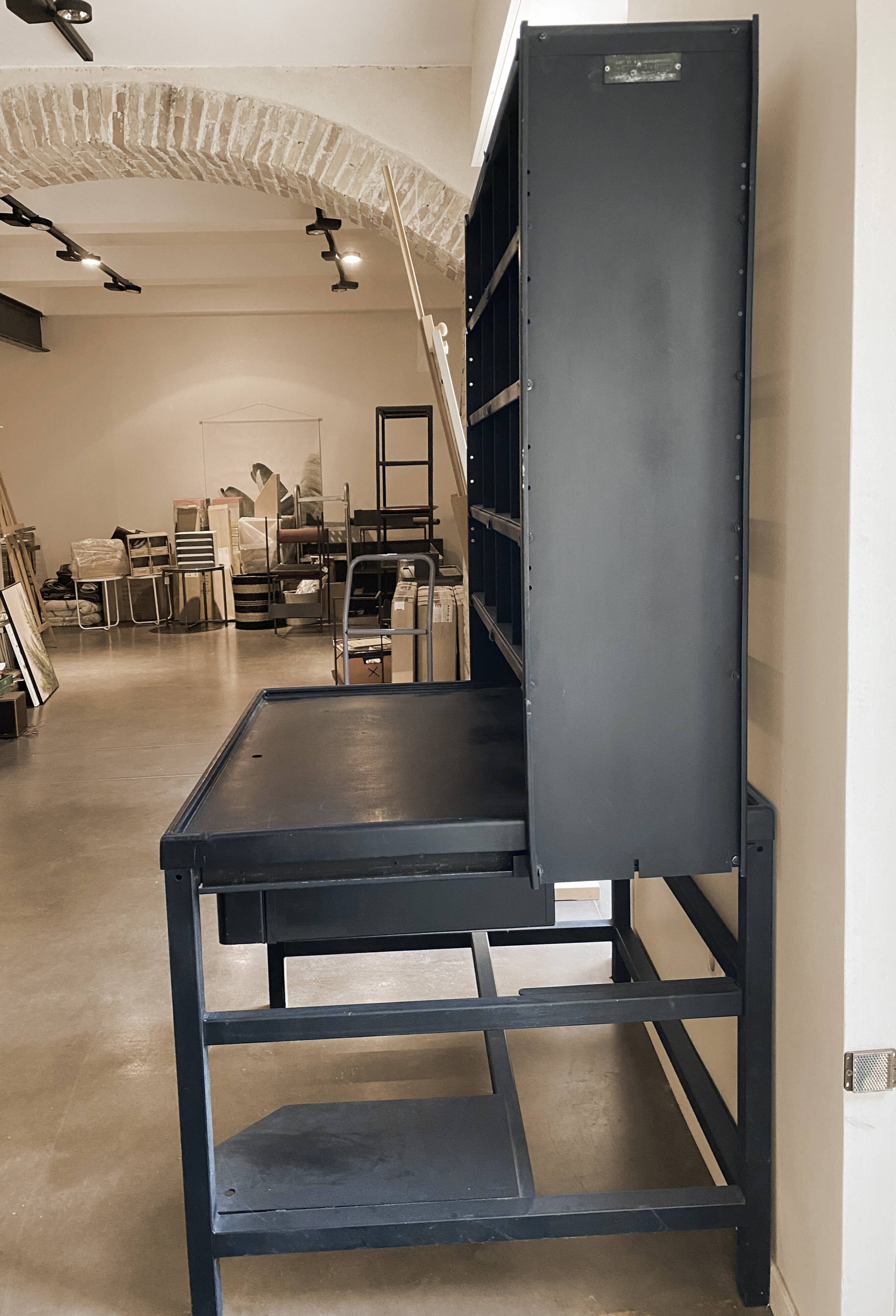 Postal sorting desk with a sliding top part back and forth.