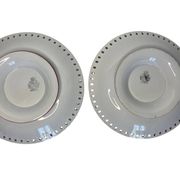 Lunéville, two floral earthenware bowls with pierced edges from the early 20th century.