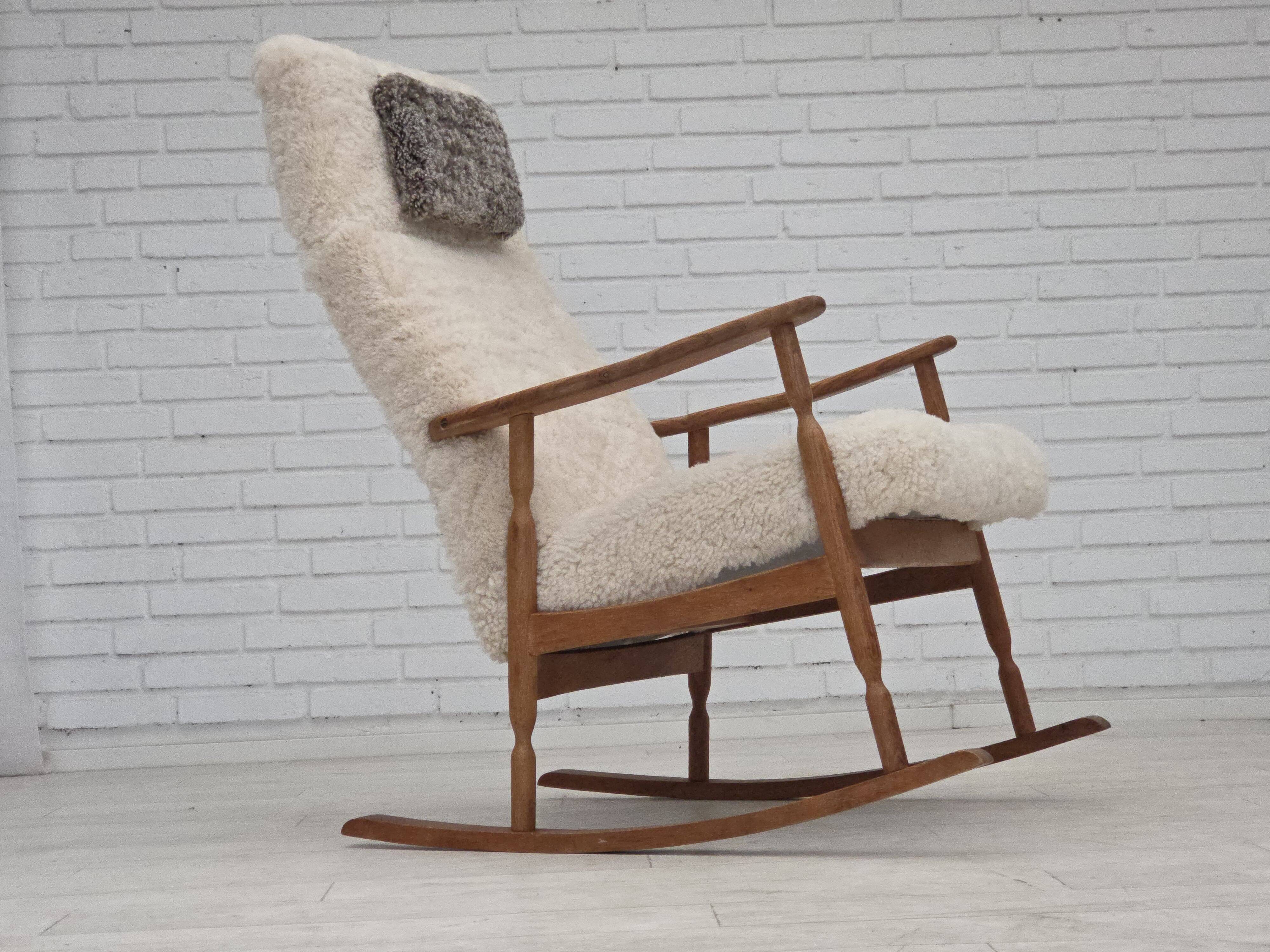 1970s, Danish rocking chair, reupholstered in quality genuine sheepskin.