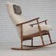 1970s, Danish rocking chair, reupholstered in quality genuine sheepskin.