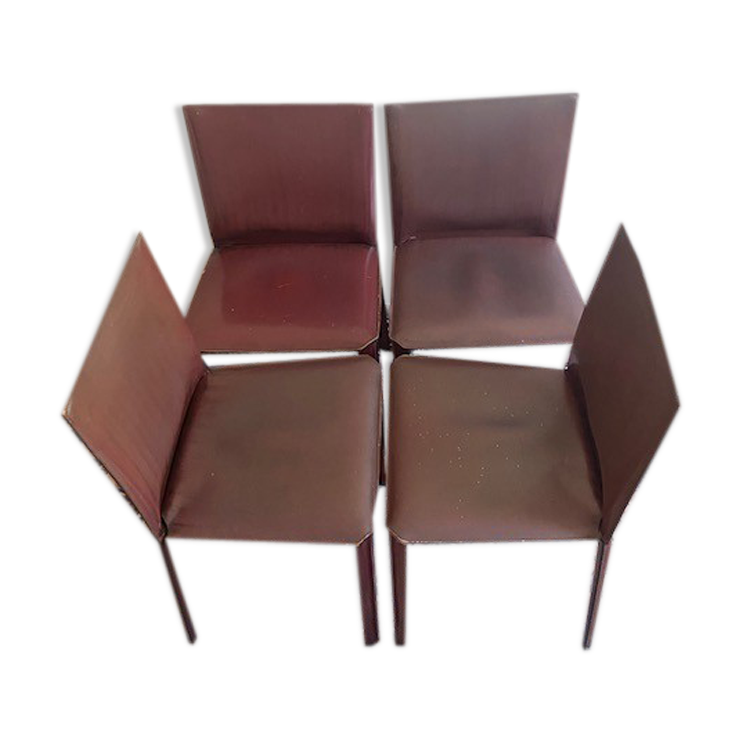 Suite of four Matéo Grassi chairs sheathed in burgundy leather