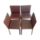 Suite of four Matéo Grassi chairs sheathed in burgundy leather