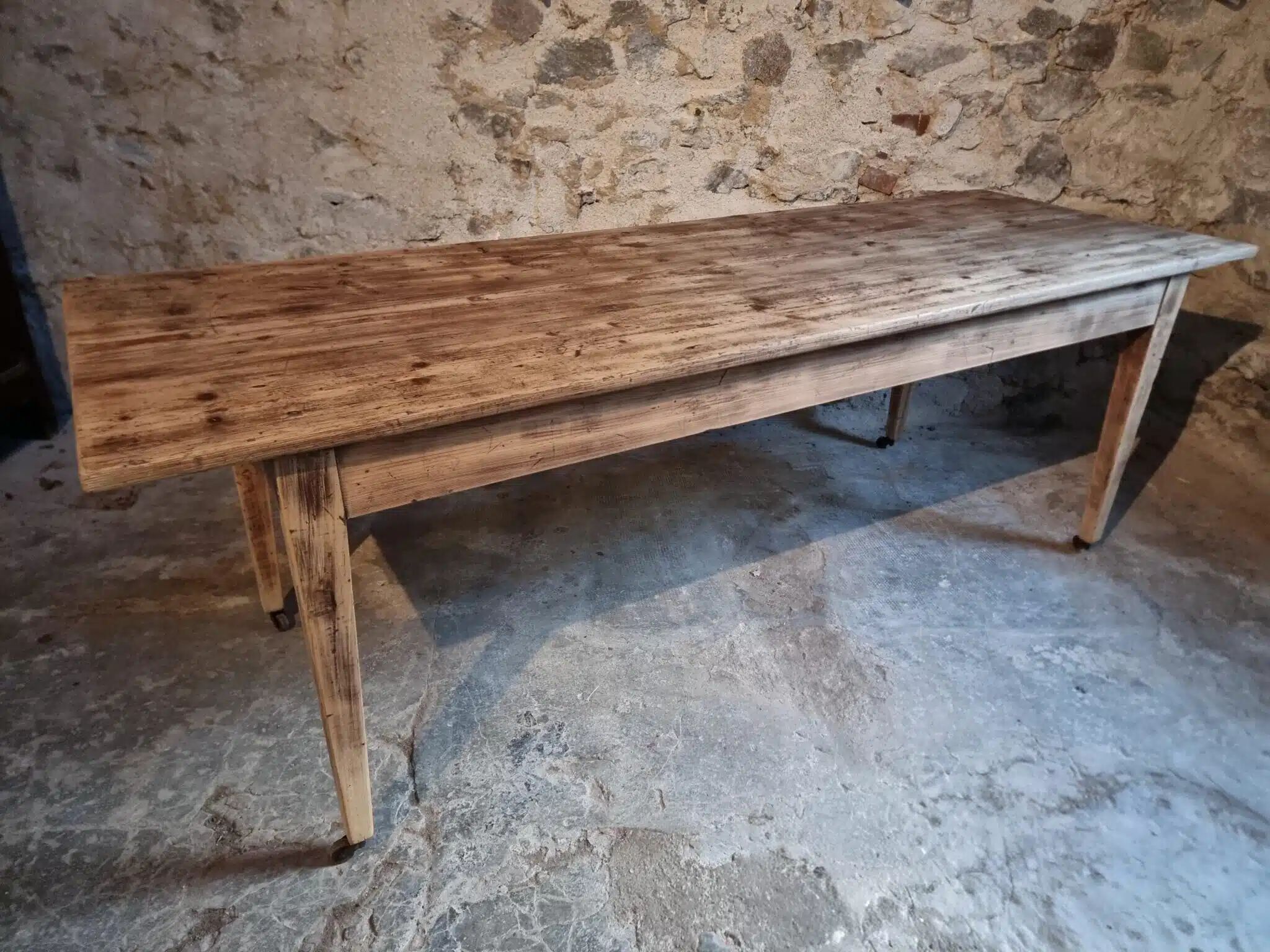 Antique French pine dining table, large farmhouse table on wheels, 19th century.