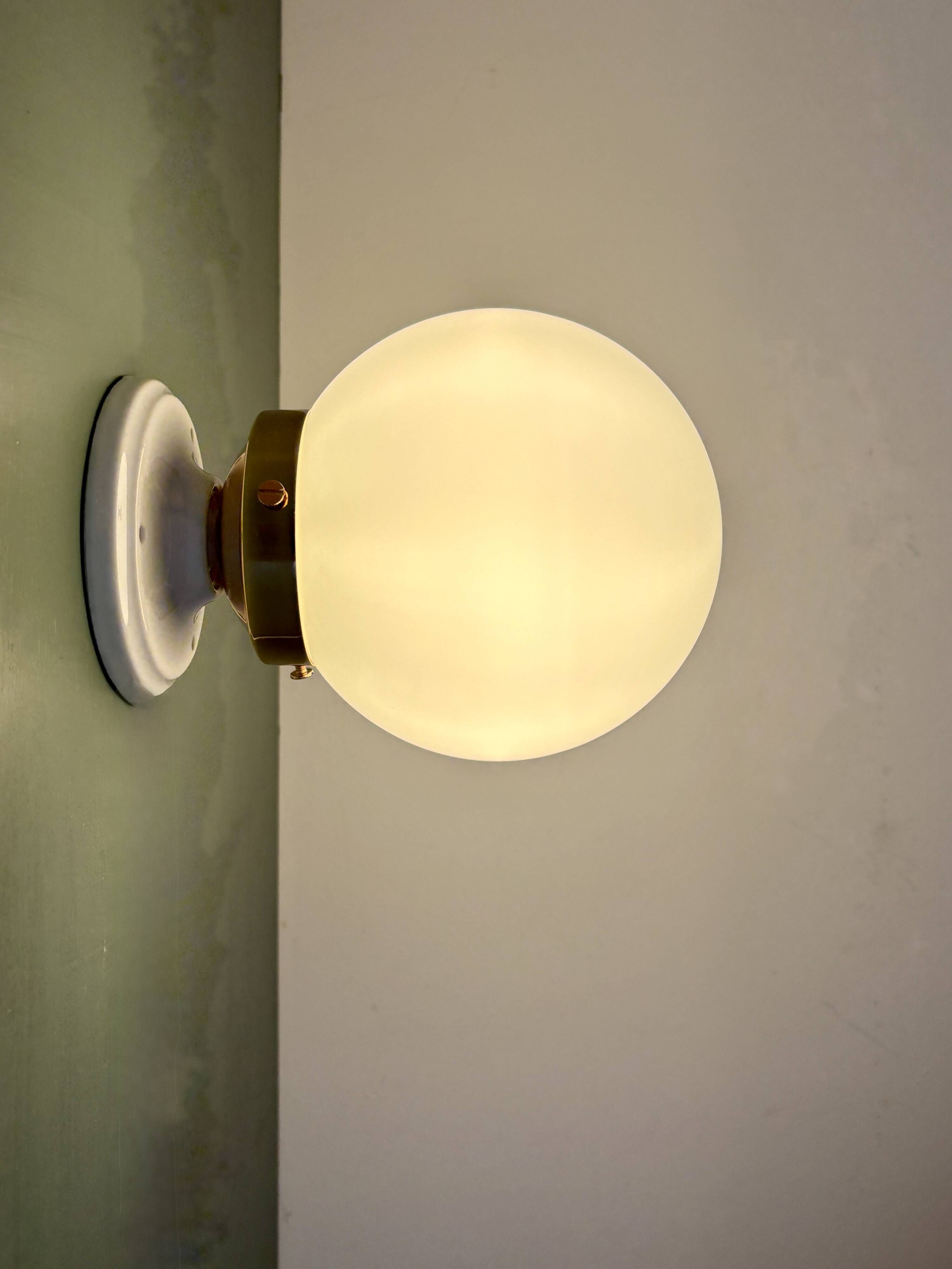 Vintage globe wall or ceiling light in white opaline.