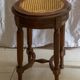Antique armchair and stool with caned seat and fluted legs