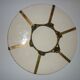 Ceramic plate underside on bronze stand
