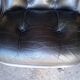 Fauteuil Charles Pollock cuir noir époque 1970